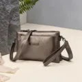 Fashionable PU multi-compartment women shoulder crossbody handbag with metal strap and grey finish. - Bronze