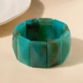 Vue détaillée d'un bracelet en acrylique marbré sarcelle avec texture à tourbillons - Bleu sarcelle