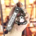 Astronaut UFO vloeibare drijvende sleutelhanger schattige ruimte tas hanger creatief cadeau - Zwart en goud ruimteschip astronaut - Skateboardmodel