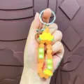 Leuke lotus siliconen sleutelhanger met gelukshanger voor handtassen en autosleutels. - Lotus geluksarmband van zacht rubber - Oranje
