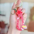 Leuke roze sleutelhanger van zacht rubber met regenboog en sterren, gouden metalen ring. - Regenboog ster siliconen armband - Rood