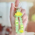 Green silicone lotus keychain with beads and lucky charm design for bags and keys. - Lotus Good Luck Soft Rubber Bracelet - Green