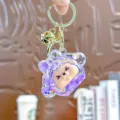 Leuke paarse acryl kiki drijfzand sleutelhanger met mooie belletje en gouden ring. - Individuele Verpakking / Kleine Kiki - Tweekleurige bubbelkralen paars