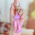 Pink silicone lotus keychain with good luck charms and gold metal rings for keys. - Lotus Good Luck Soft Rubber Bracelet - Purple