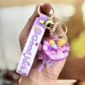 Leuke paarse vloeibare zandloper lolly sleutelhanger met kleurrijke kralen voor dames en kinderen. - Paars