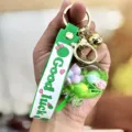 Leuke vloeibare drijfzand lolly sleutelhanger met kleurrijke kralen voor tasje. - Groen
