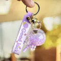 Paarse vloeibare drijvende lolly sleutelhanger schattige meisje tas bedel autosleutelhanger. - Paars