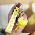 Mooie vloeibare drijfzand lolly sleutelhanger met schattige gele tas hanger cadeau - Geel