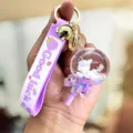 Schattige paarse eenhoorn drijfzand lolly sleutelhanger, stijlvolle siliconen band rugzak hanger. - Lolly Eenhoorn / Paars