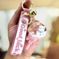 Schattige roze eenhoorn drijfzand fles sleutelhanger met roze siliconen band en bel. - Lolly Eenhoorn / Roze