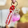 Cute quicksand lollipop keychain for women and girls, aesthetic bag charm and car key accessory. - Red
