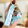 Leuke blauwe eenhoorn drijfzand sleutelhanger met siliconen band en bal hanger. - Lolly Eenhoorn / Blauw