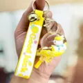 Schattige eenhoorn vloeibare glitter sleutelhanger met bel, gele strap en heldere hangende bedel. - Lolly Eenhoorn / Geel