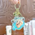 Leuke acryl drijfzand sleutelhanger met bel, schattige cartoonfiguur tas charm hanger. - Individuele Verpakking / Little Kiki - Tweekleurige bubbelparels groen