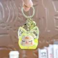 Leuke acryl quicksand sleutelhanger met gele dierlijke bedel en gouden metalen ring tas. - Individuele Verpakking / Tweekleurige bubbelparels vossenkop - Geel