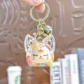 Leuke acryl drijfzand sleutelhanger met bel, transparante tas hanger ornament voor sleutels. - Individuele Verpakking / Tweekleurige bubbelparels vossenkop - Regenboogkleuren