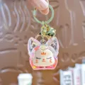 Leuke acryl drijfzand sleutelhanger met roze kattenoorontwerp, metalen ring en bel tas hanger. - Individuele Verpakking / Glimmende vossenkop - Roze