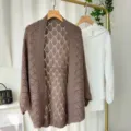 Close-up detail of the brown hollow knit cardigan showing the delicate diamond pattern weave. - Coffee