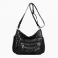 Black multi-pocket soft leather shoulder bag for women, stylish crossbody day bag. - Black