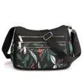 Borsa a tracolla in nylon multi tasche da donna con stampa di foglie botaniche colorate. - Foglie verdi