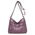 Purple soft leather women crossbody bag with multiple zippers and adjustable shoulder strap. - Purple