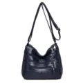 Borsa a tracolla classica da donna in pelle morbida blu scuro con tasche con zip. - Blu scuro