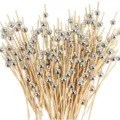 Disposable bamboo cocktail picks with silver beads for fruit, desserts, and party use. - Silver