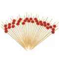 12cm disposable bamboo cocktail picks with red beads for fruit, sushi, and party drinks. - Red