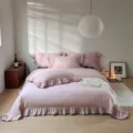 Solid purple cotton 4-piece bedding set featuring elegant ruffle trim and cozy sheets. - Dan Ruo / Four-piece Bedsheet Set For 1.5m Bed