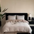 Close-up detail of wabi-sabi style cotton bedding set, showing delicate jacquard floral pattern. - Flying Feathers - Beige / [Flat Sheet Style] 1.5m 4-Piece Set - Duvet Cover 200x230