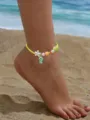 Κοντινό πλάνο boho βραχιόλι ποδιού με χάντρες και αστερία στην αμμουδιά - Υφαντό Στυλ Θαλάσσιου Στοιχείου (AF812)