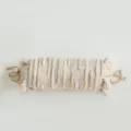 Bohemian cylindrical bolster pillow with textured tufted stripes and decorative side tassels. - Chris Candy Style