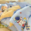 Cotton bedding set with cute astronaut space cartoon print for kids bedroom decor and comfort. - Riding the Wind Universe / 120x150cm Single Duvet Cover