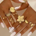 Vintage gold-plated adjustable ring set featuring unique flower shell and starfish designs for women - French Vintage Beach Starfish and Shell Ring Set (6487701)