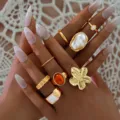 Vintage style gold ring set featuring flower pearl and enamel details on manicured hands - Enamel Flower Imitation Pearl Gold Set (6544001HB) / Gold
