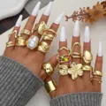Gold irregular enamel ring set with open adjustable designs and flower pearl accents - Sixteen-Piece Gold-Tone Hollow Floral Artificial Pearl Style (6665801HB)