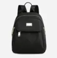 Zwarte mini nylon rugzak voor dames, casual reisdagrugzak met metalen ritsen en vakken. - Zwart