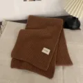 Brown knitted winter scarf for women, cozy thick warm woolen neck warmer with label detail. - Caramel color