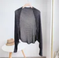 Detailed view of the ice silk knitted hollow shrug, breathable mesh summer arm cover shawl. - Black