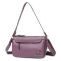 Borsa a tracolla viola in morbida pelle per donna, elegante variante di borsa retrò. - Viola