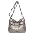 Grey quilted soft leather crossbody bag with multiple zip pockets and adjustable shoulder strap. - Bronze