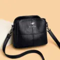 Schwarze mehrschichtige Damen Umhängetasche große Kapazität elegantes Lederdesign. - Schwarz