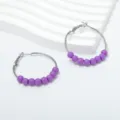Detailed shot of trendy purple beaded hoop earrings, stylish retro metal design for women. - Purple Bead Small Hoop