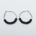 Detail view of retro style metal hoop earrings featuring elegant black beaded details for women. - Black Bead Silver Hoop