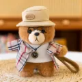 Cute plush bear doll keychain with plaid trench coat, hat, and mini clock pendant. - Artist - Black & White Plaid