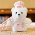 Cute white plush bear keychain with pink chef hat and apron, adorable cartoon bag pendant accessory. - Chef Style in Pink