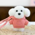 Cute white dog plush toy keychain with pink hoodie pendant, perfect for backpack decoration. - Dog in Hoodie - Pink 12 cm