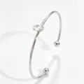 Silver tone metal cuff bracelet featuring a marquise cubic zirconia and dual ball ends. - Open Marquise Zirconia Bangle (RT235SZ-1)