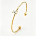 Gold open cuff bracelet with baguette zircon, stainless steel minimalist wrist jewelry SKU - Gold Open Rectangle Zirconia Bangle (RT234SZ)