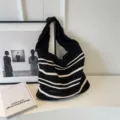 Black and white striped knitted shoulder bag, casual hobo tote bag, trendy woven design. - Black